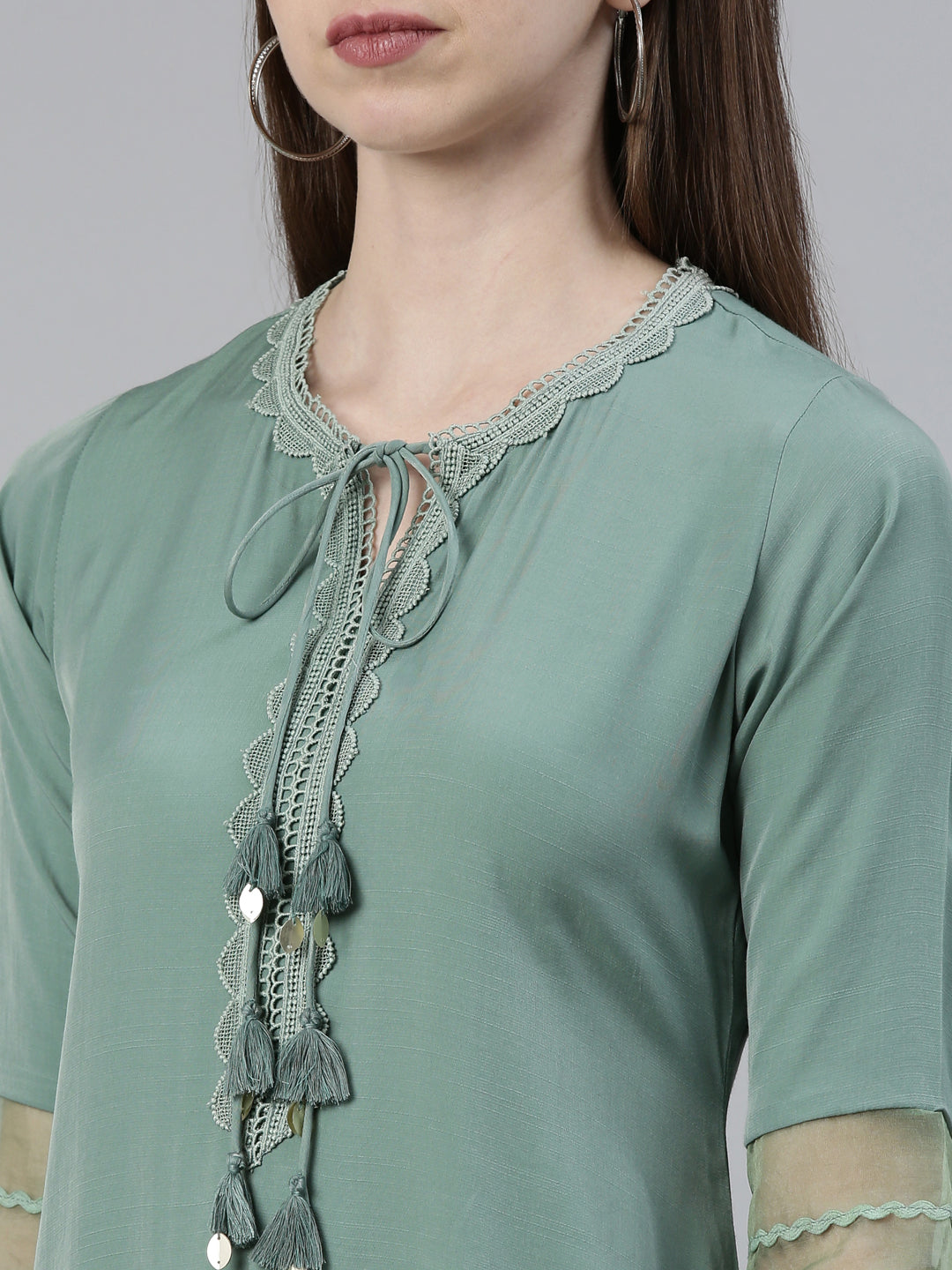 Neerus Green viscose rayon solid A-line kurti - detail view 1