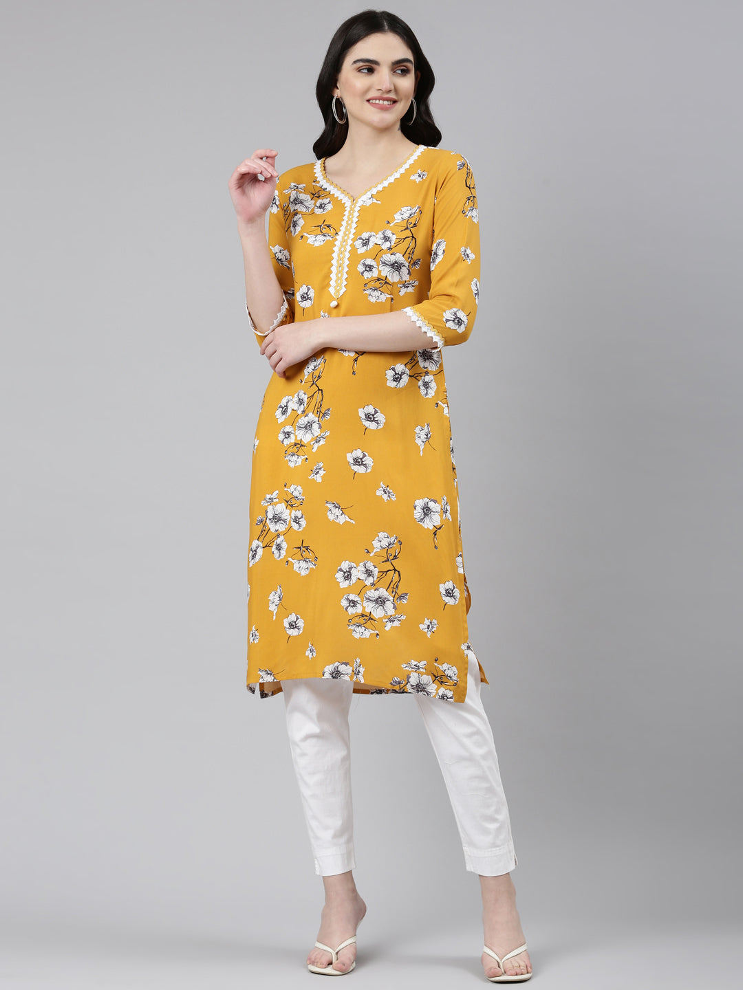 Neerus Yellow rayon solid straight kurti - front view