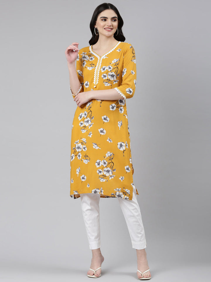 Neerus Yellow rayon solid straight kurti - front view