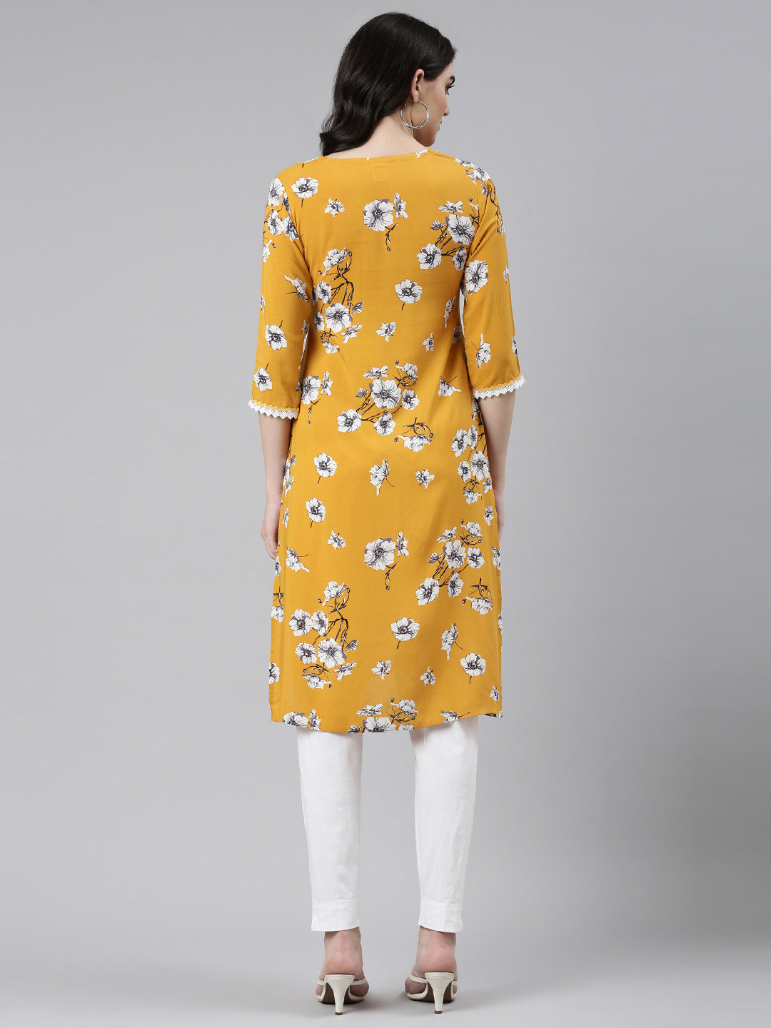 Neerus Yellow rayon solid straight kurti - side view