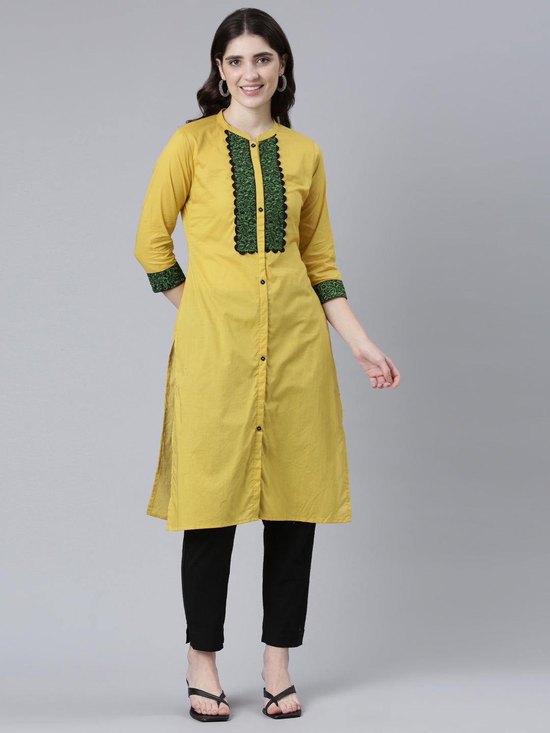 Neerus Yellow cotton solid straight kurti - front view