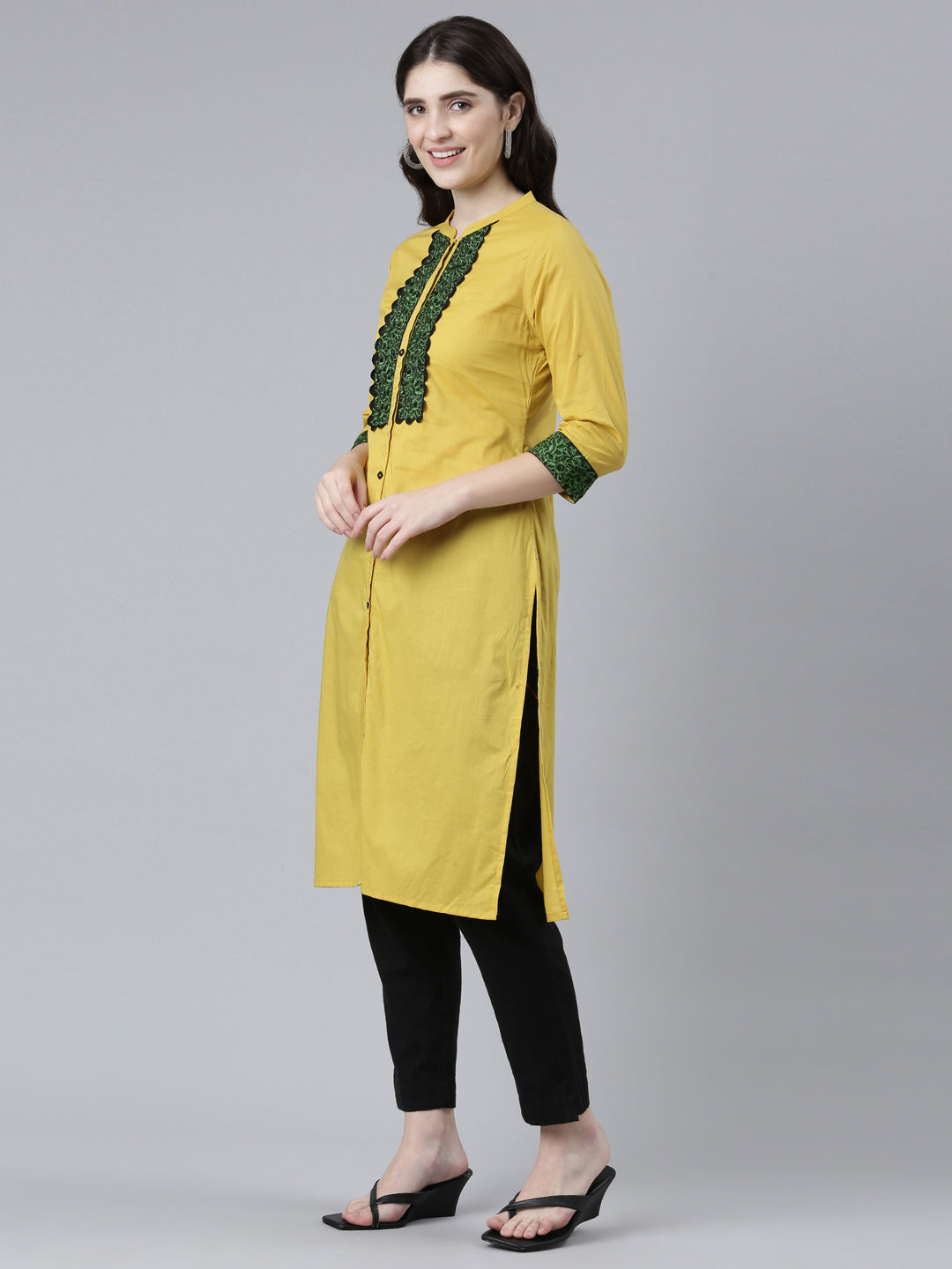 Neerus Yellow cotton solid straight kurti - back view