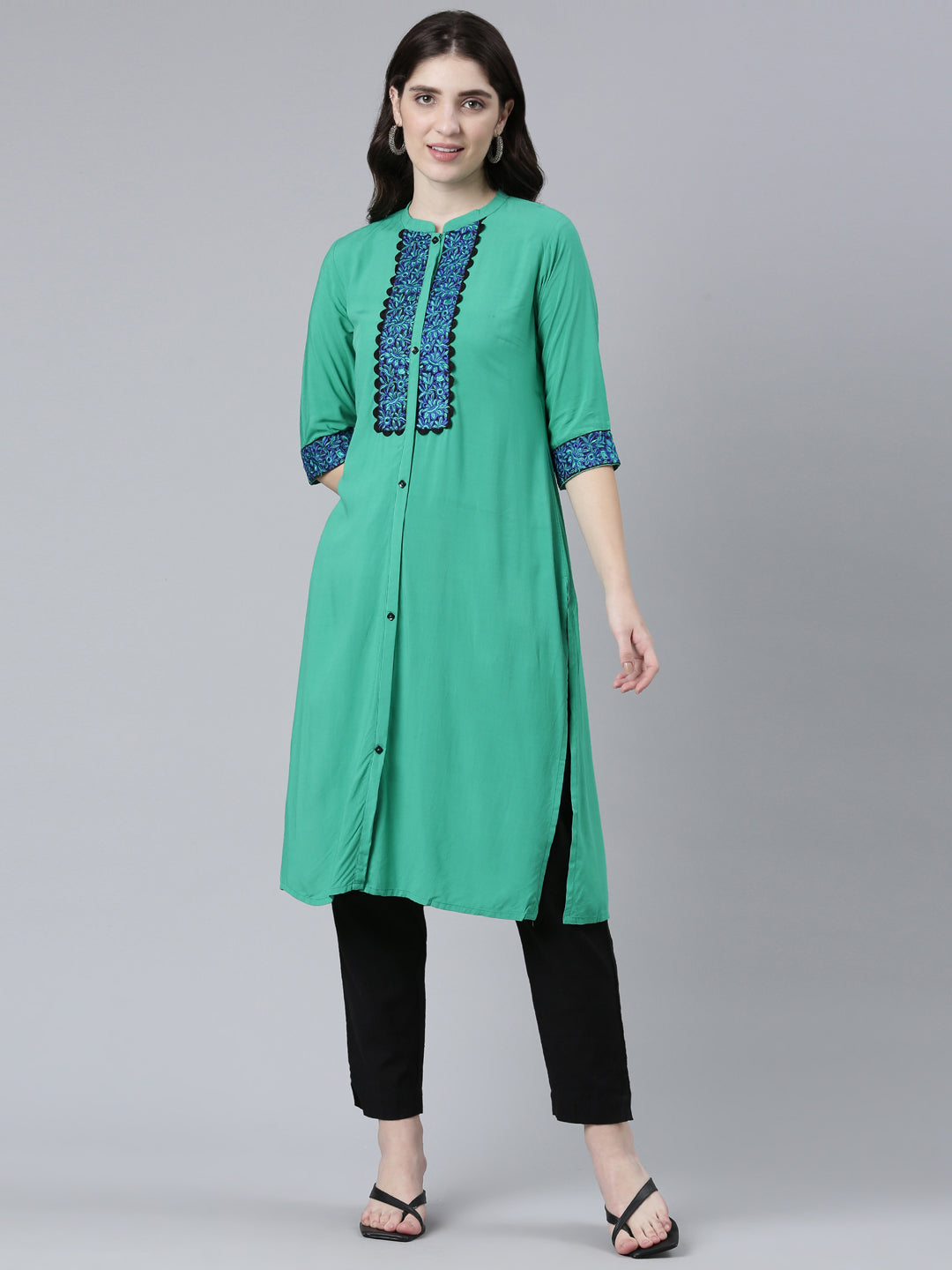 Neerus Green rayon solid straight kurti - front view