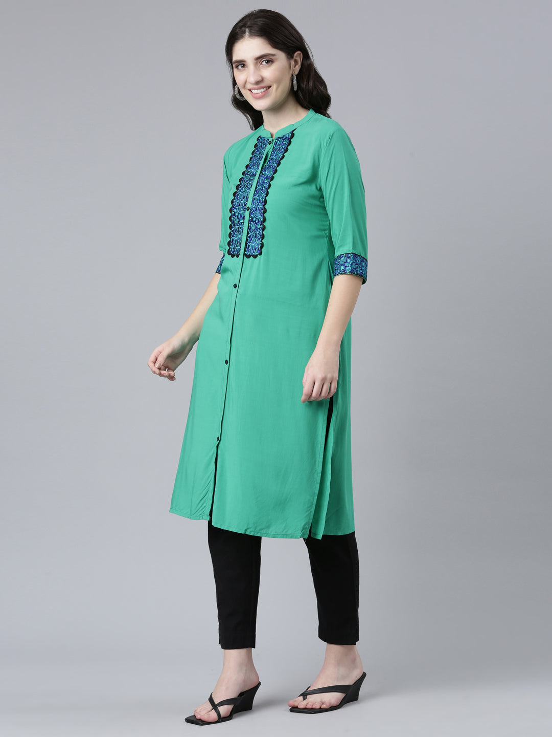 Neerus Green rayon solid straight kurti - back view
