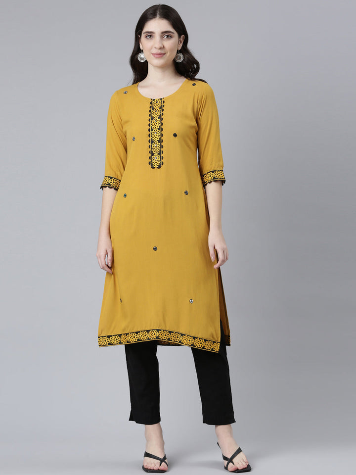 Neerus Yellow rayon solid straight kurti - front view