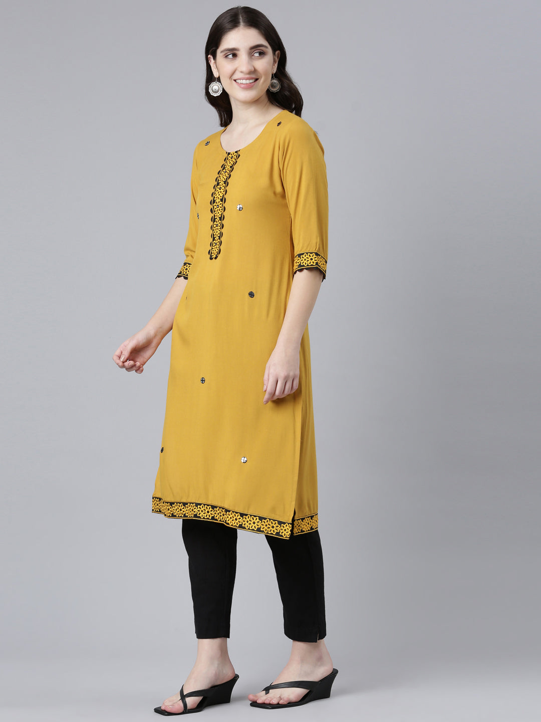 Neerus Yellow rayon solid straight kurti - back view