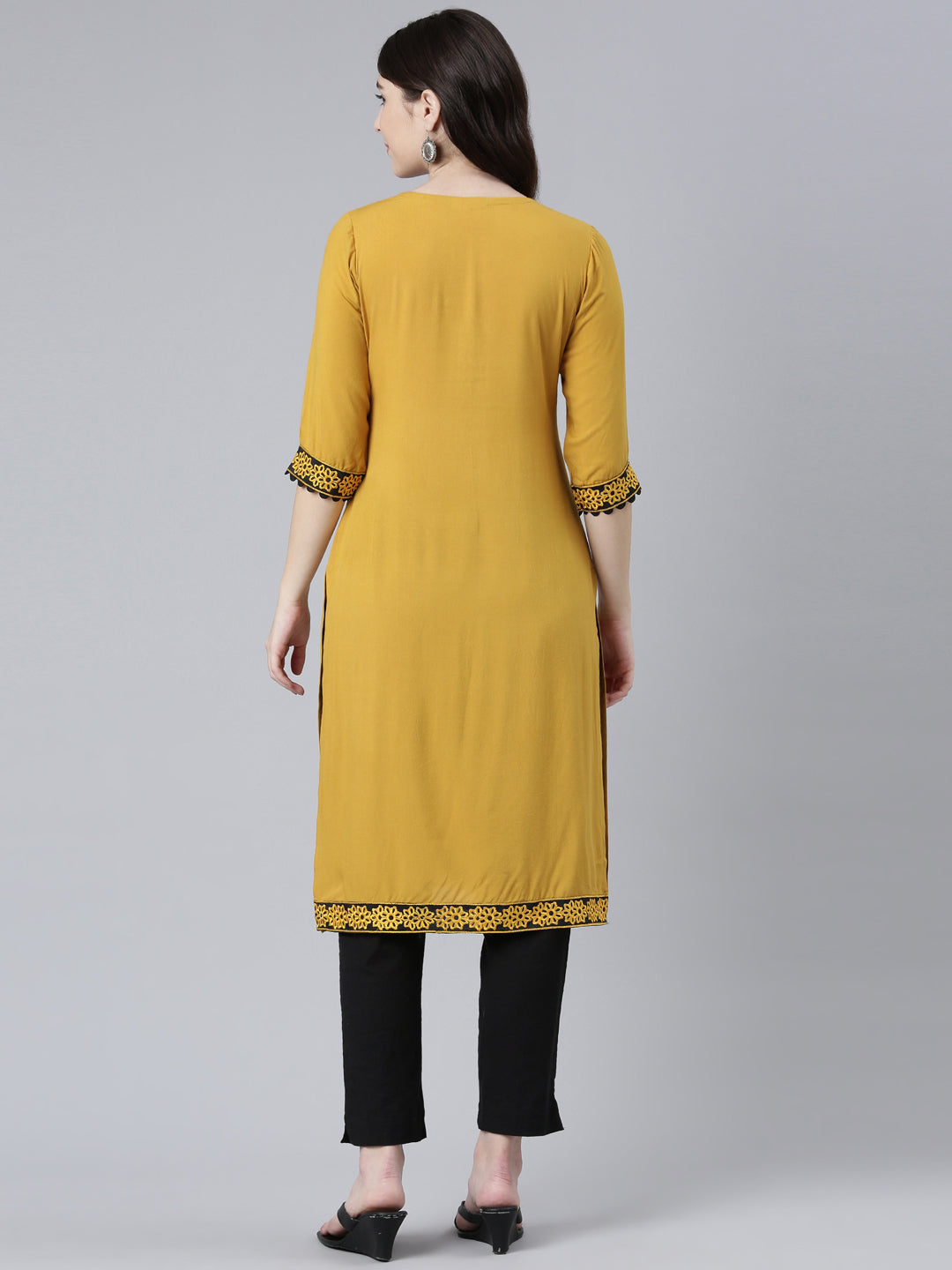 Neerus Yellow rayon solid straight kurti - side view