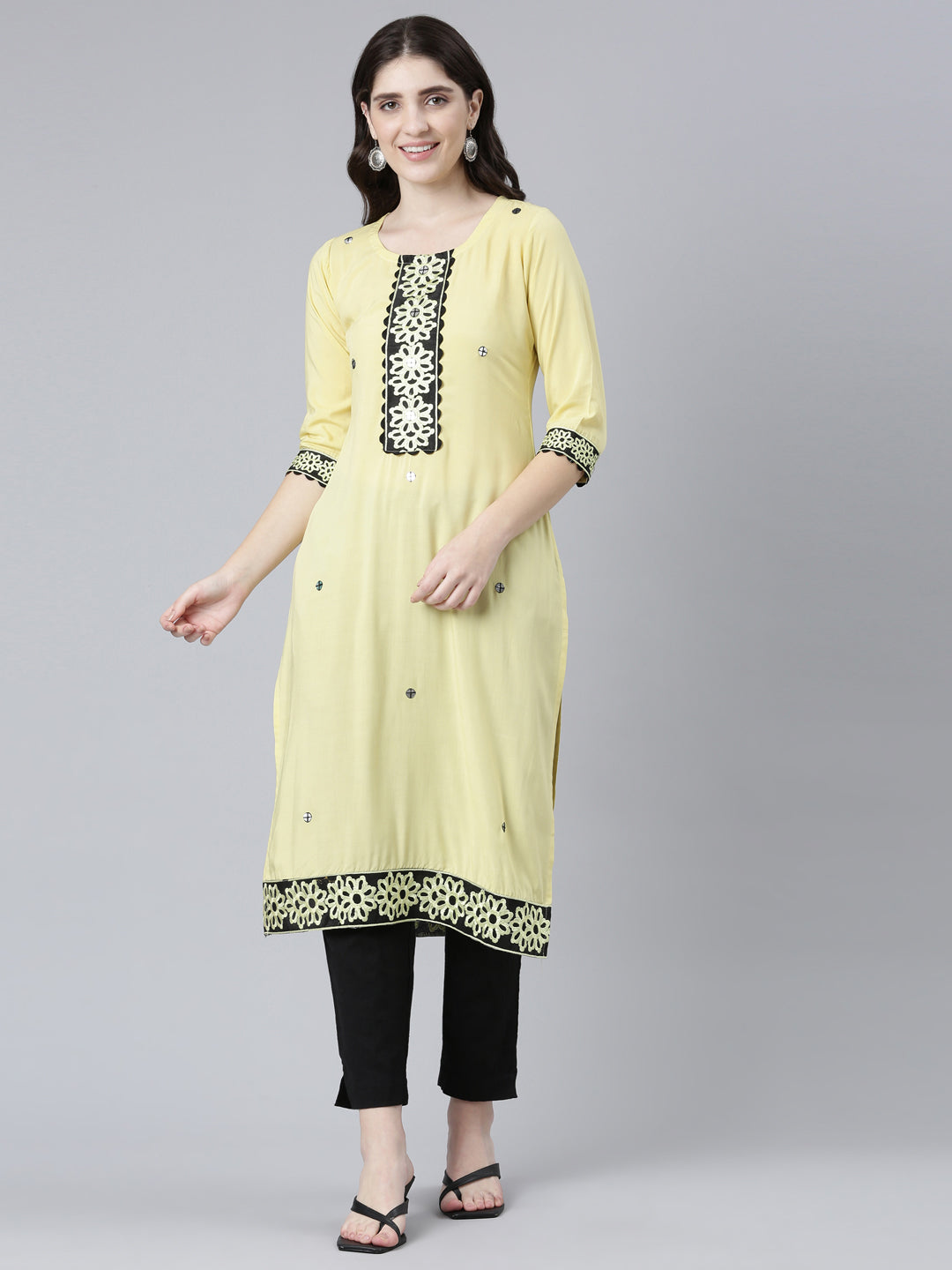 Neerus Yellow rayon solid straight kurti - front view