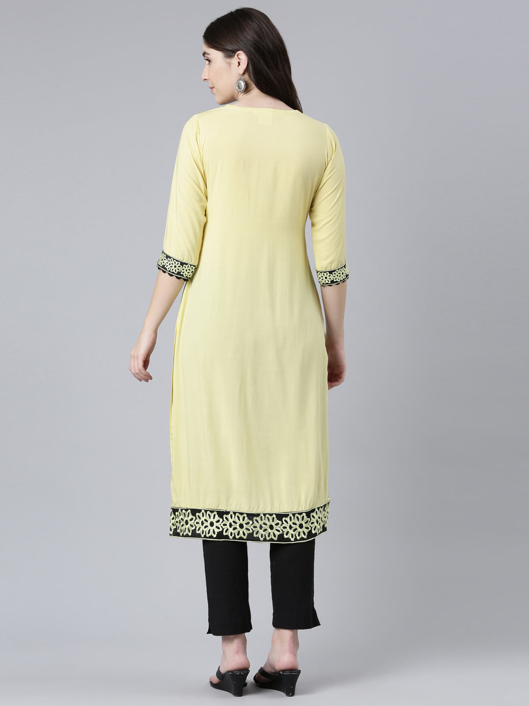 Neerus Yellow rayon solid straight kurti - side view