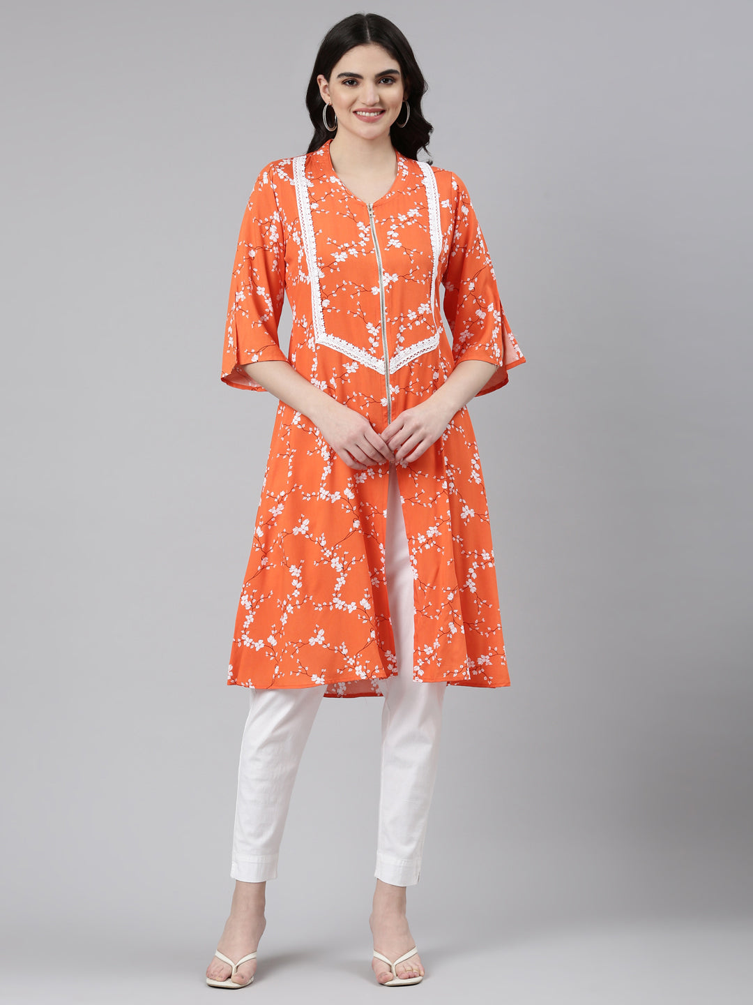 Neerus Orange rayon solid straight kurti - front view