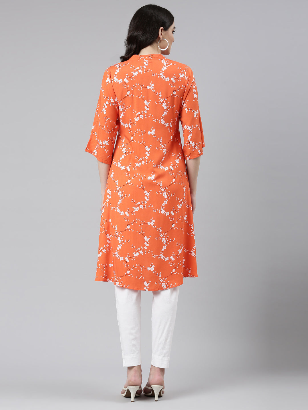 Neerus Orange rayon solid straight kurti - side view