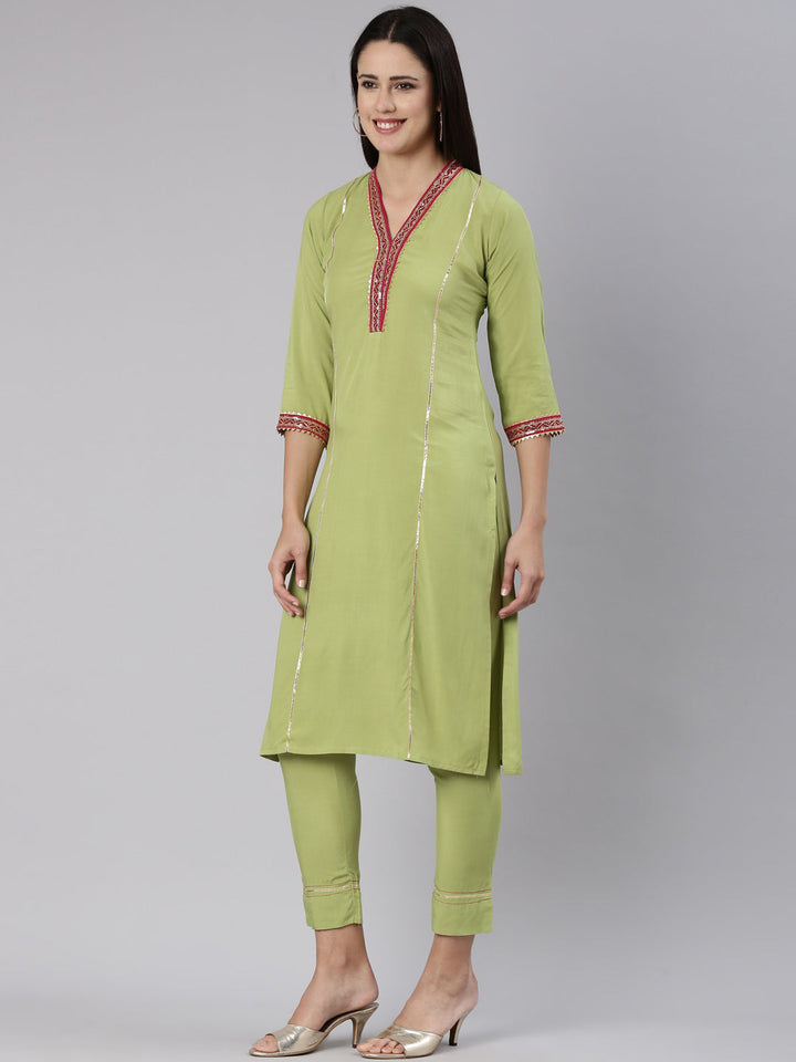 Neerus Green rayon solid kurta set - back view
