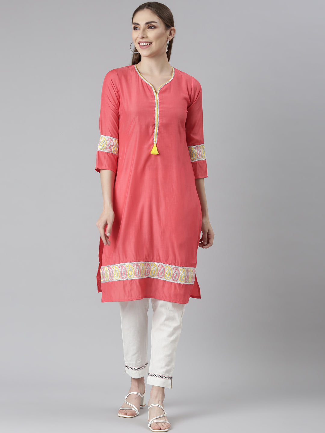 Neerus Orange rayon solid straight kurti - front view