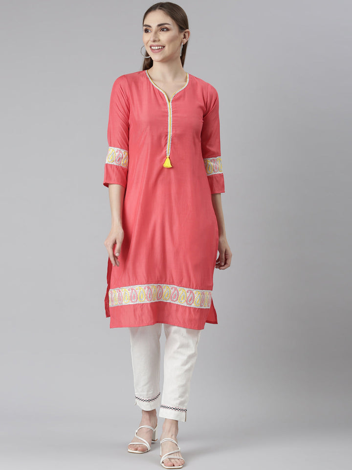 Neerus Orange rayon solid straight kurti - front view