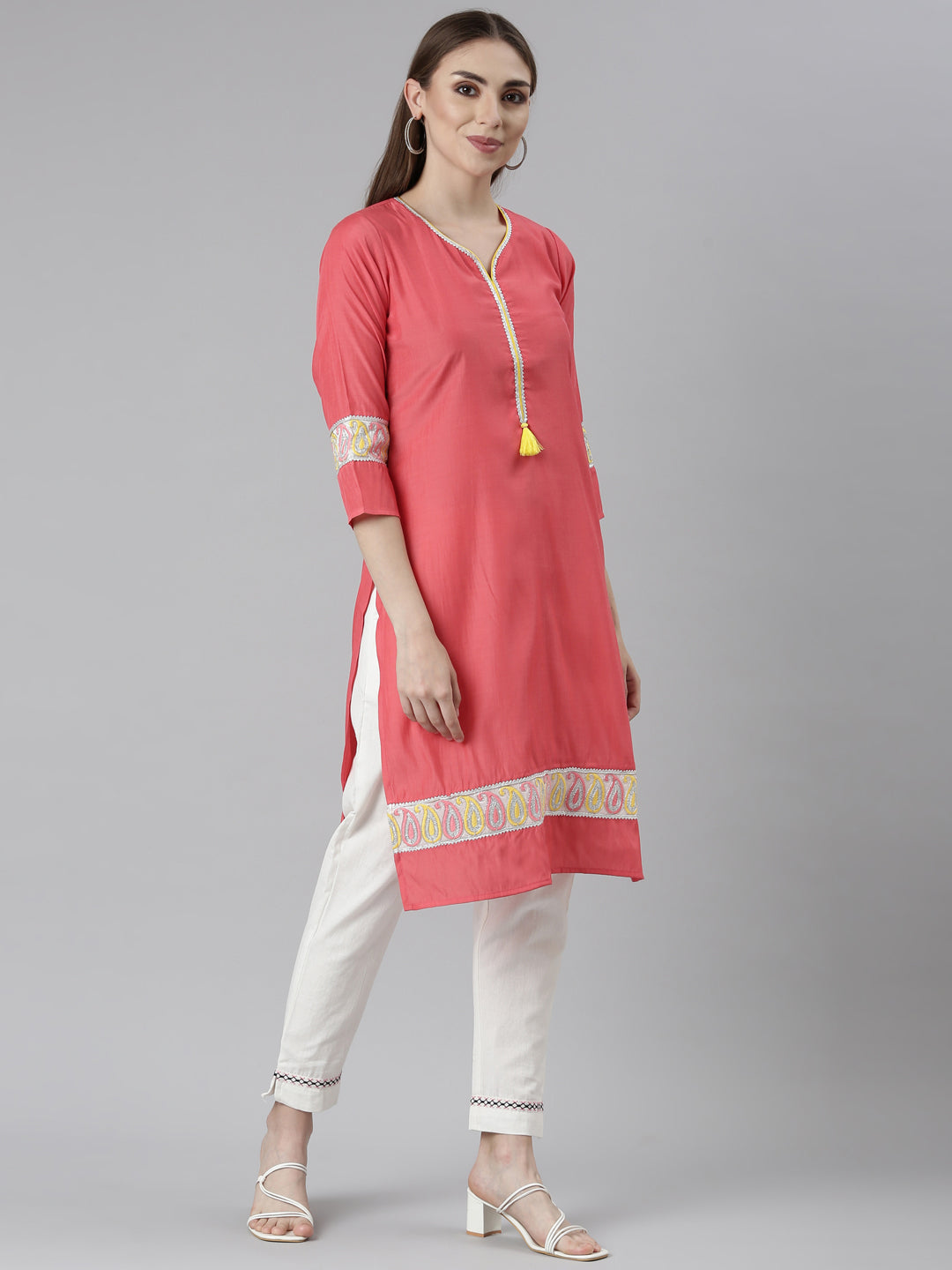 Neerus Orange rayon solid straight kurti - back view