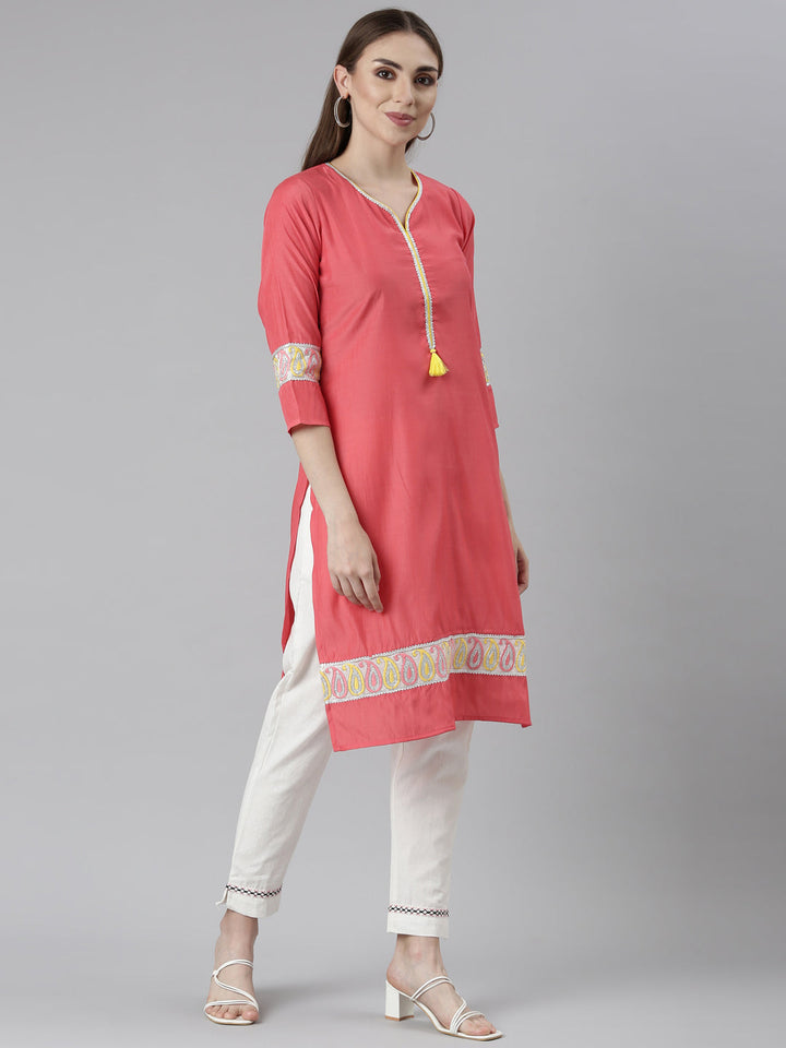 Neerus Orange rayon solid straight kurti - back view