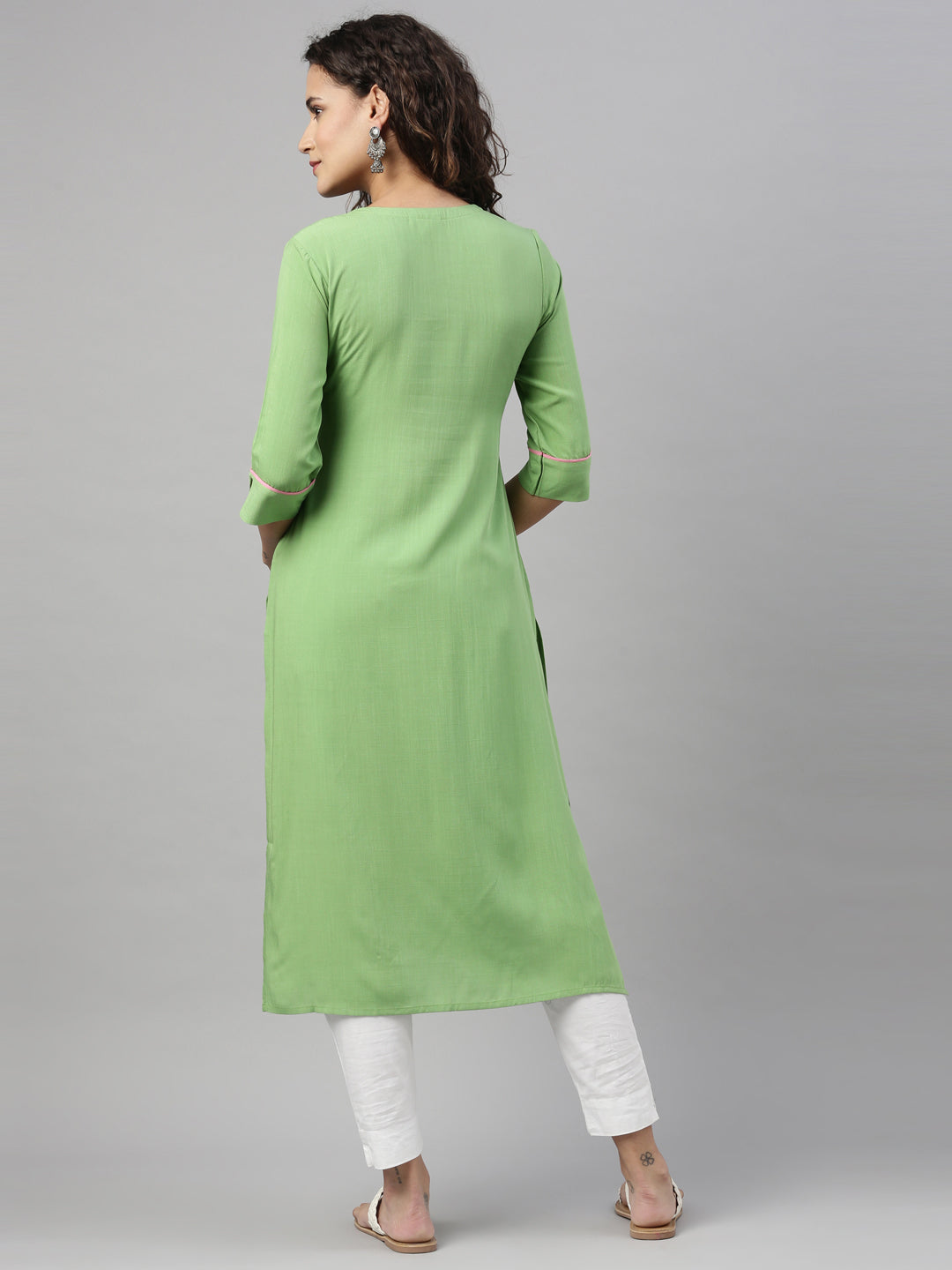 Neerus Green rayon solid straight kurta - back view