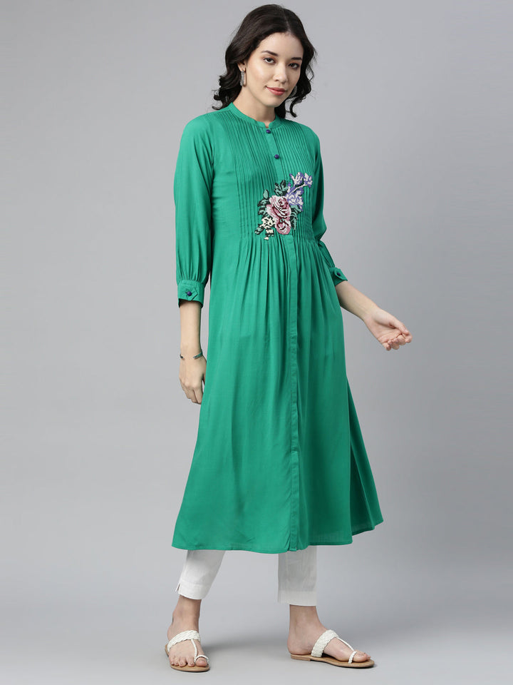 Neerus Green rayon panelled A-line kurti - front view