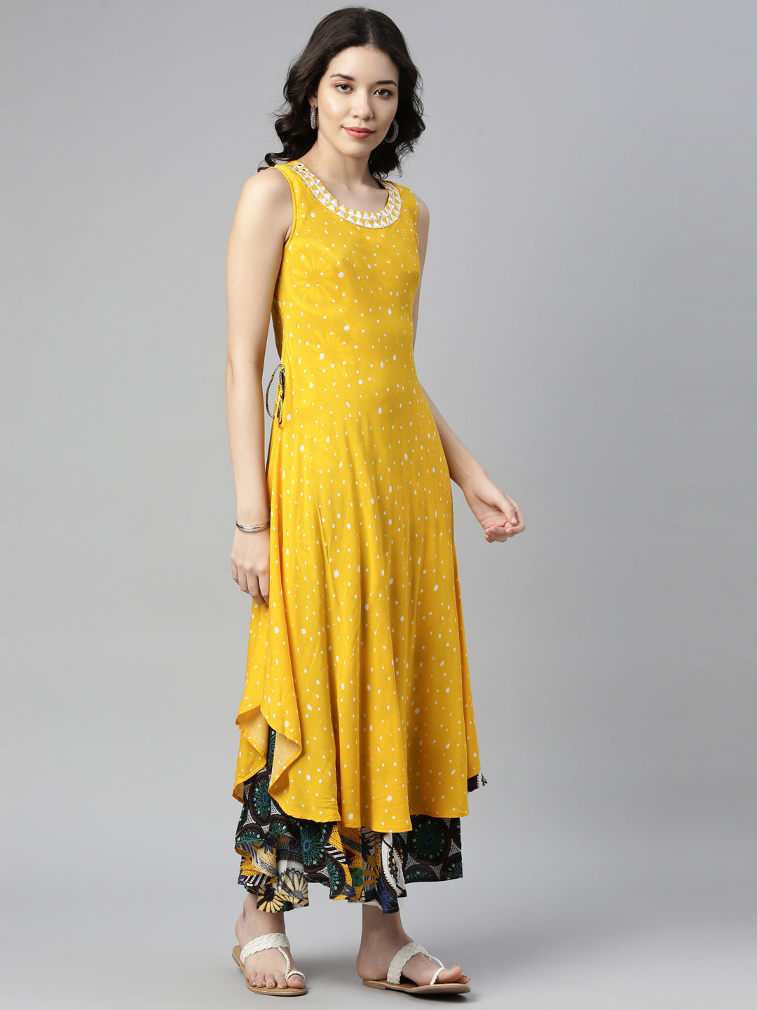 Neerus Yellow rayon mirror work A-line kurti - front view