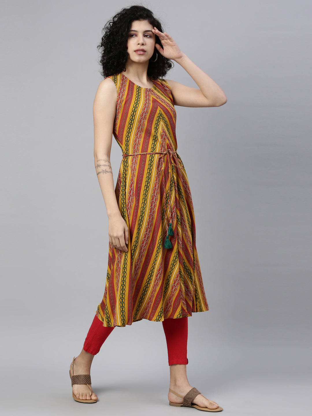 Neerus Yellow rayon printed A-Line kurti - front view