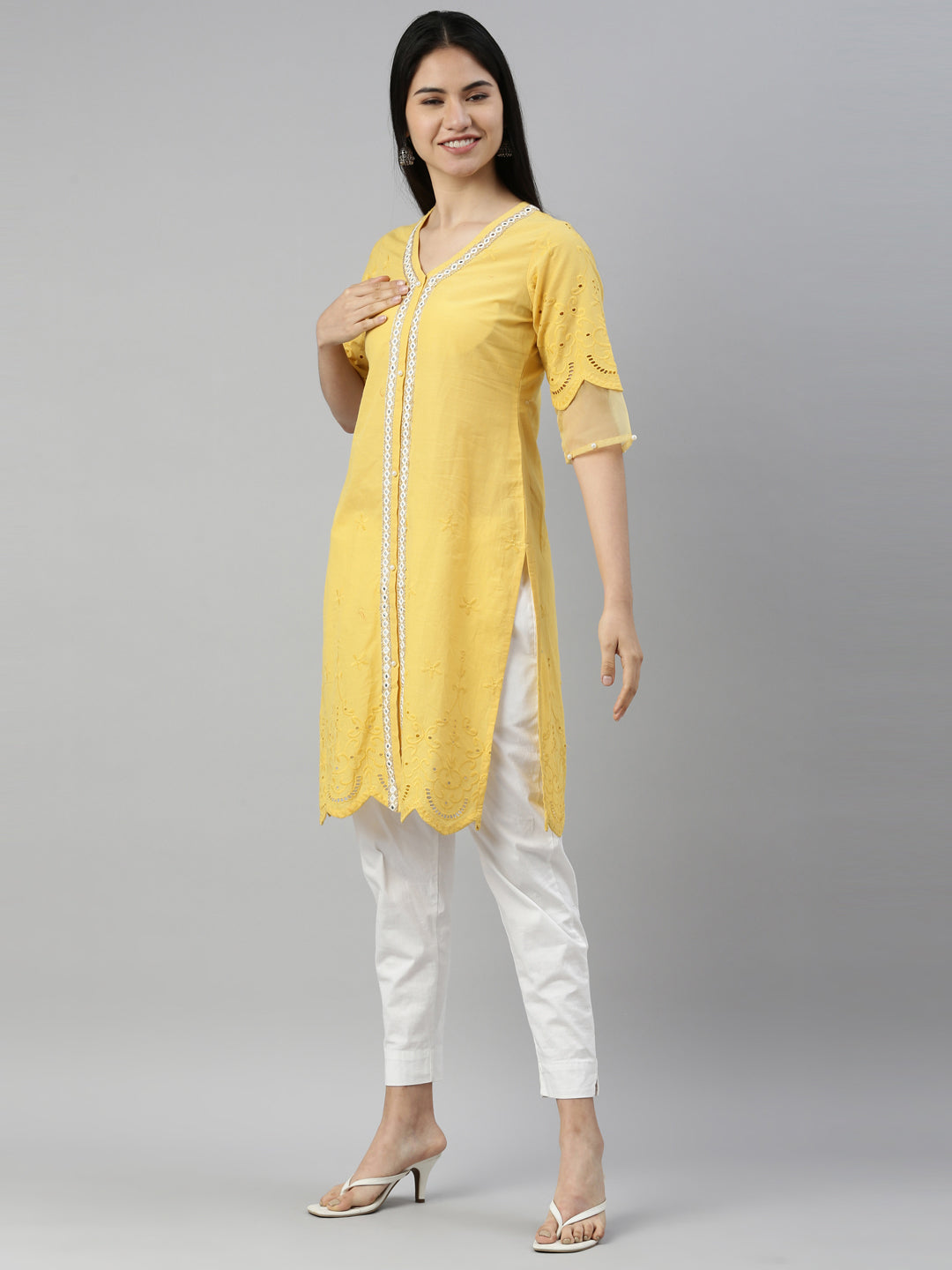 Neerus Yellow cotton mirror work kurta straight cut - back view