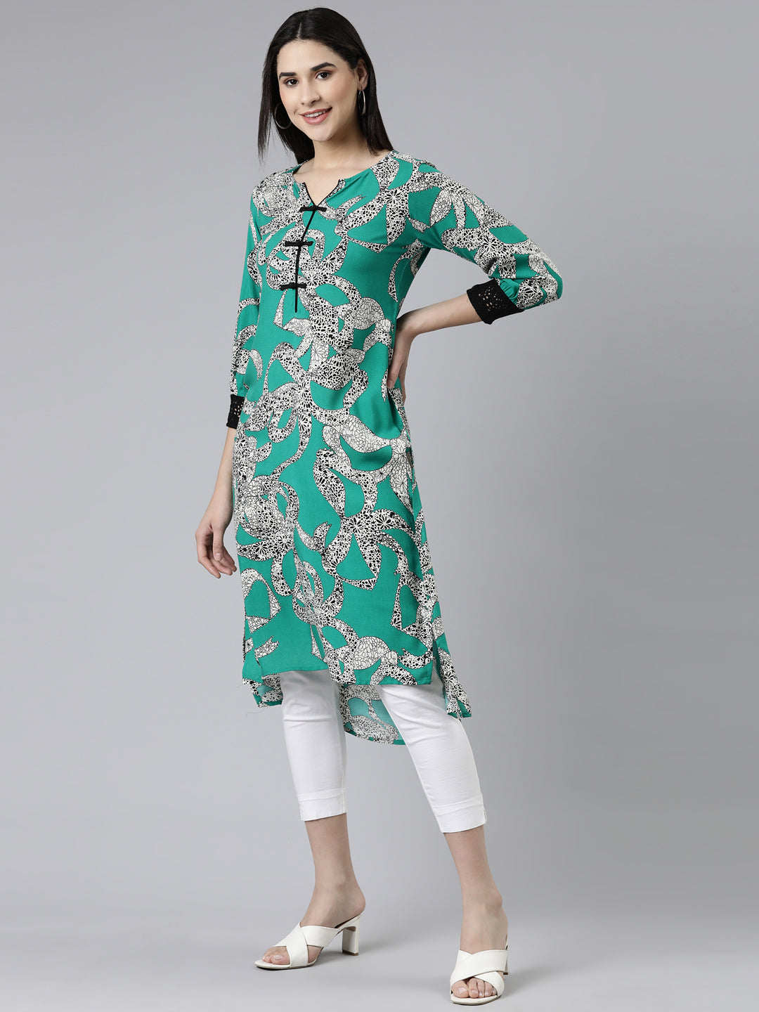 Neerus Green cotton printed curved kurti - back view