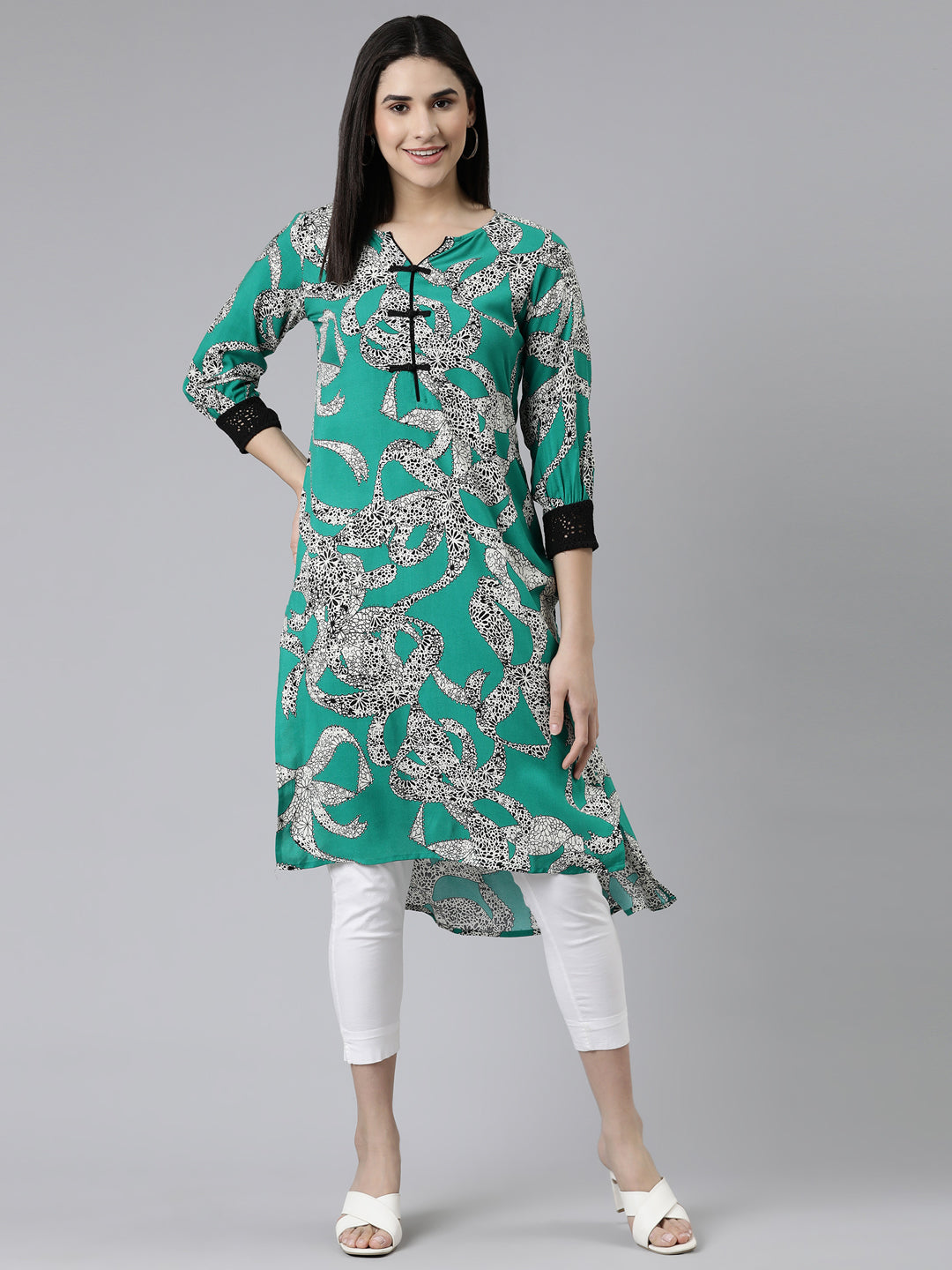 Neerus Green cotton printed curved kurti - front view