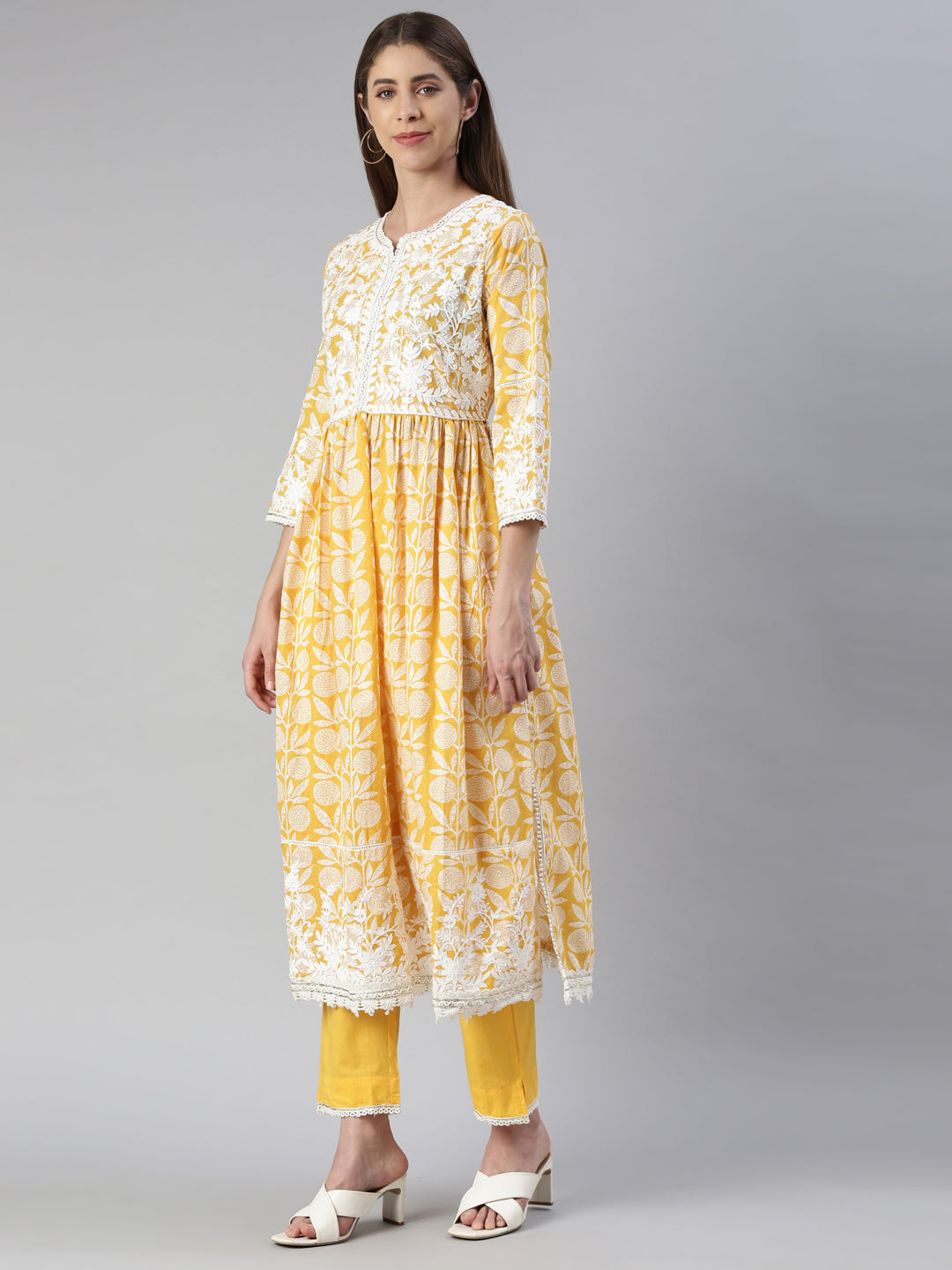 Neerus Yellow solid straight kurta set with trouser and dupatta - back view