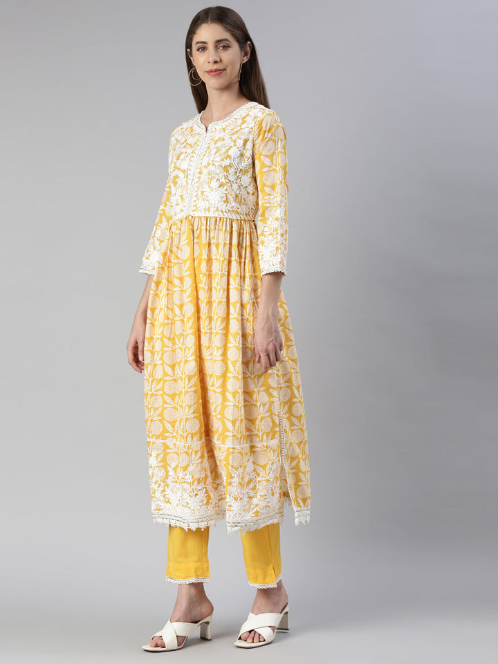 Neerus Yellow solid straight kurta set with trouser and dupatta - back view