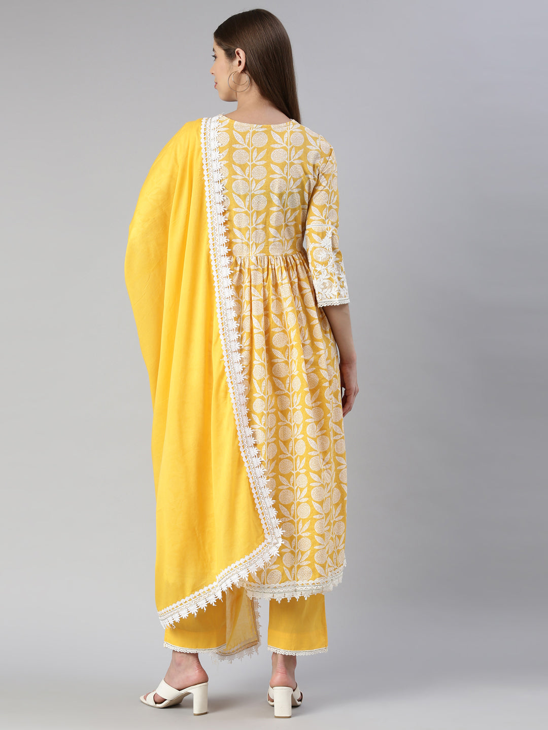 Neerus Yellow solid straight kurta set with trouser and dupatta - side view