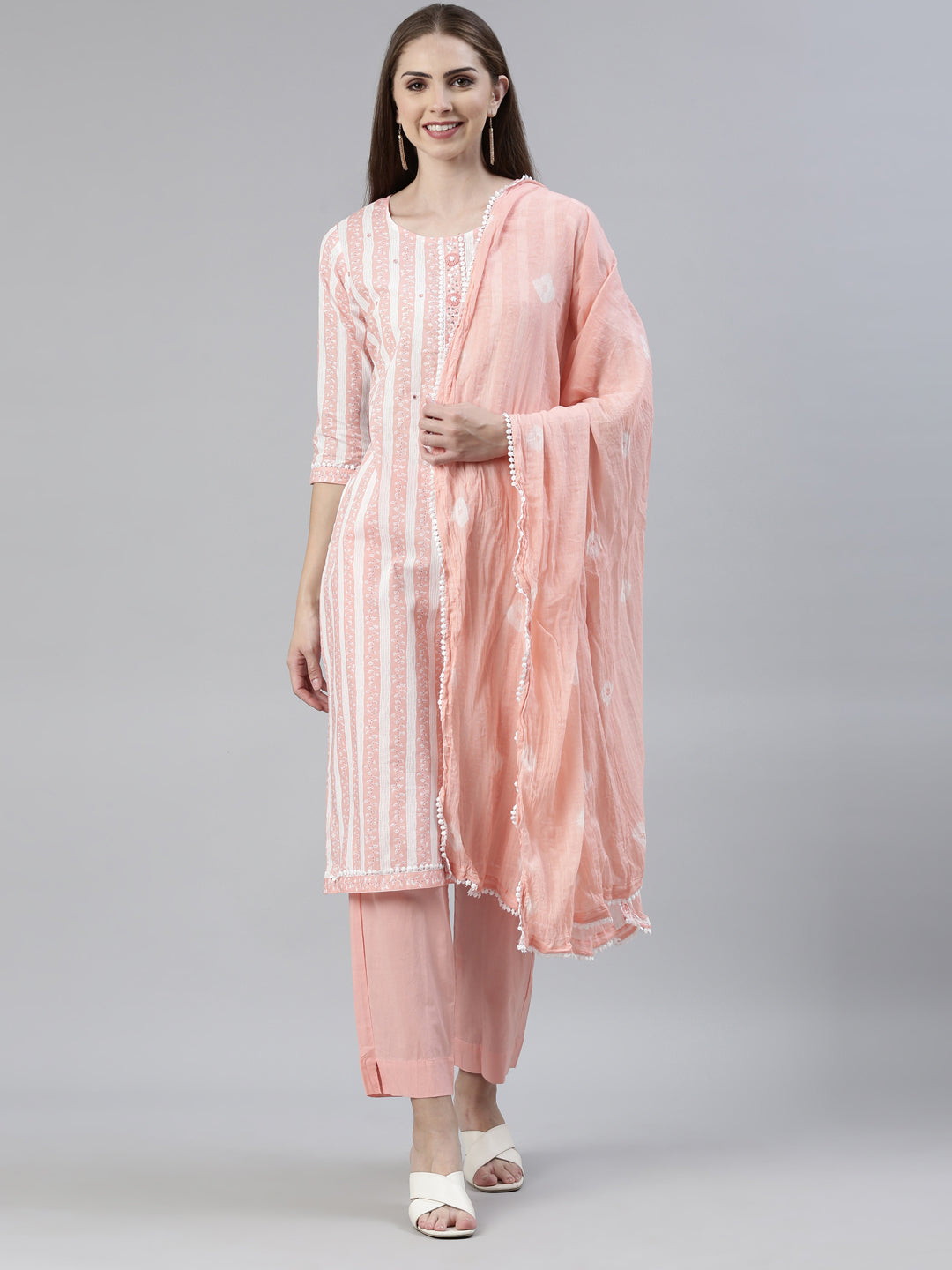 Neerus Orange solid straight kurta set with trouser and dupatta - front view