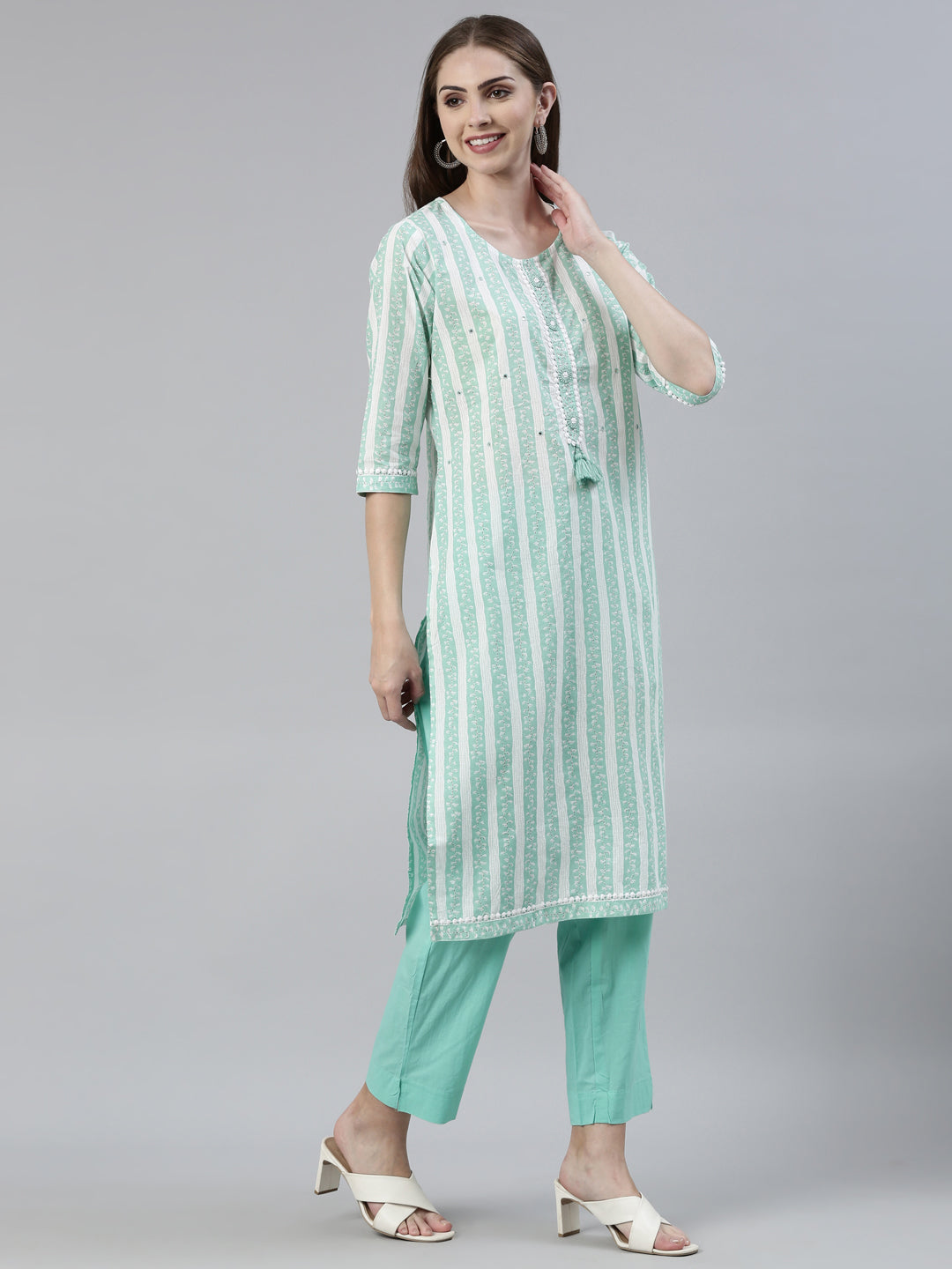 Neerus Green cotton solid kurta set with trouser and dupatta - back view