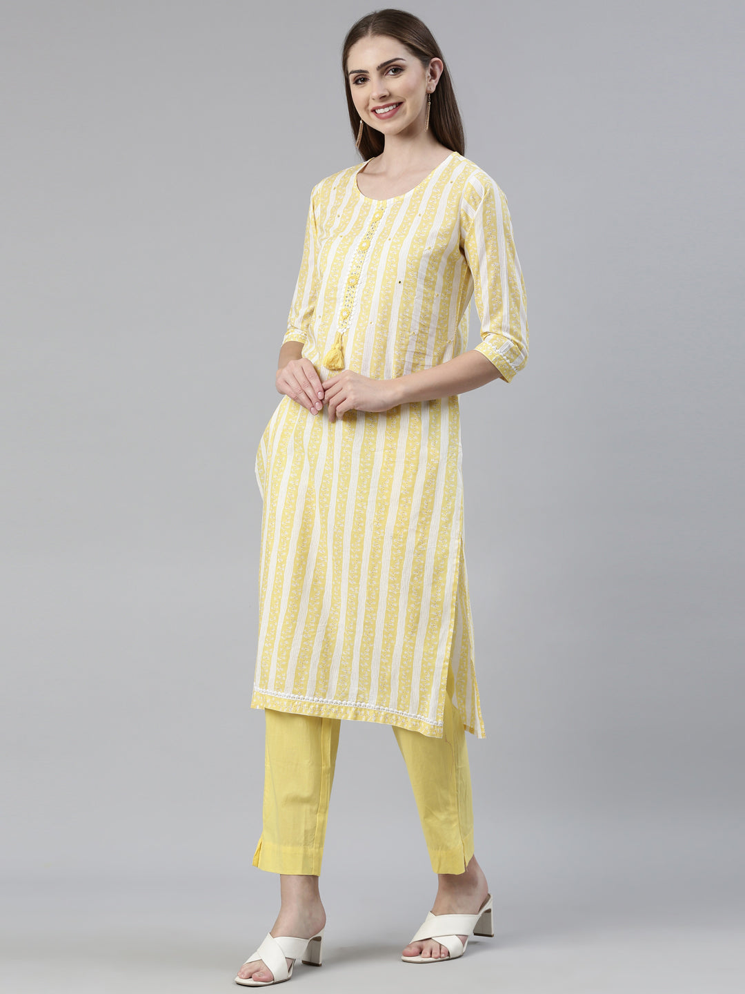 Neerus Yellow solid straight kurta set with trouser and dupatta - back view