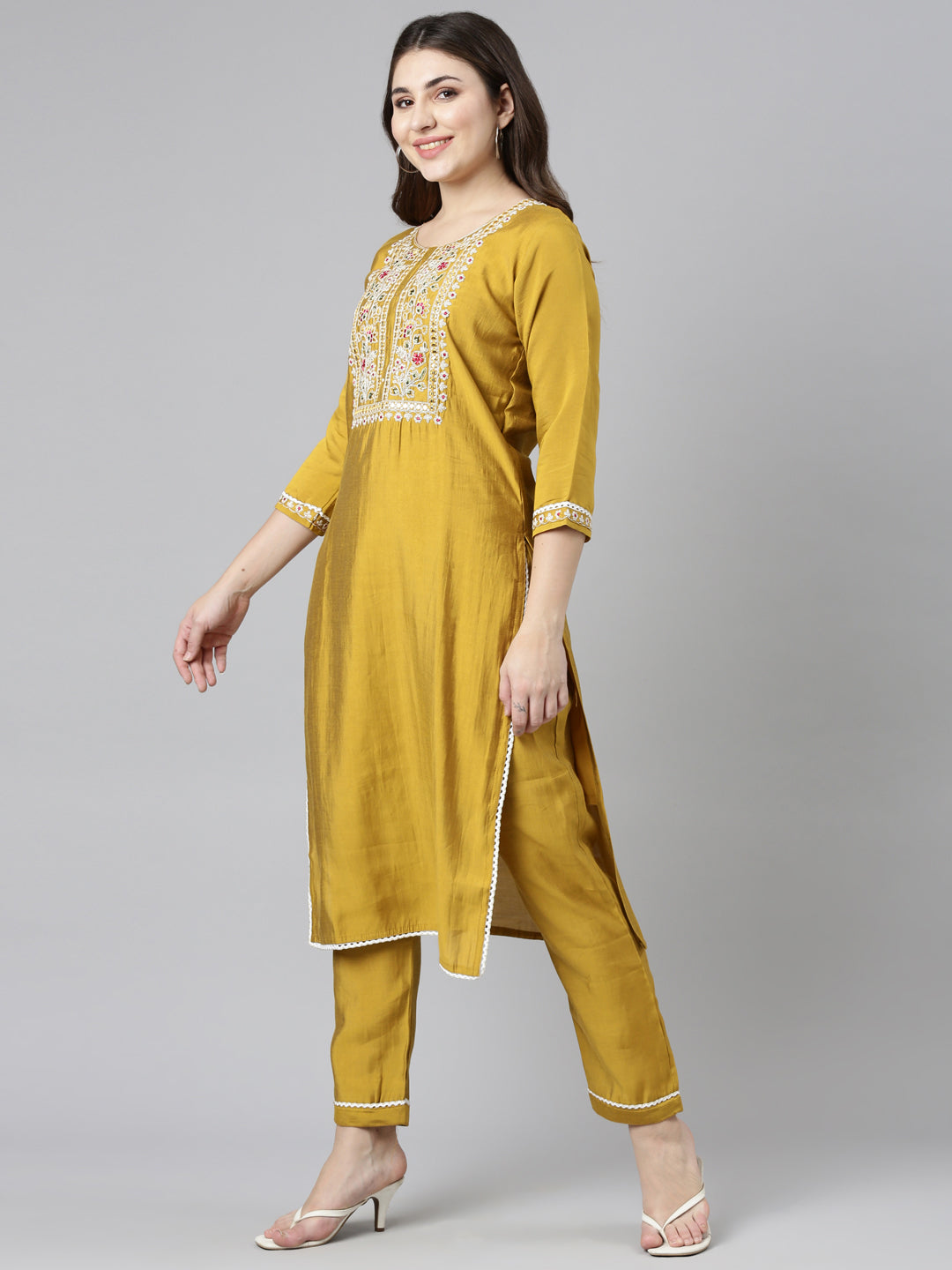 Neerus Yellow straight solid kurta set with trouser and dupatta - back view