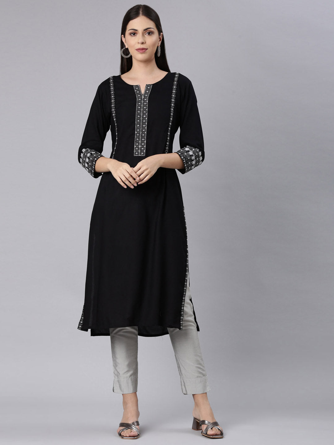 Neerus Black rayon solid straight kurti - front view
