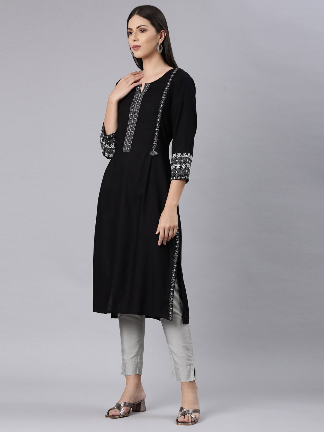 Neerus Black rayon solid straight kurti - back view