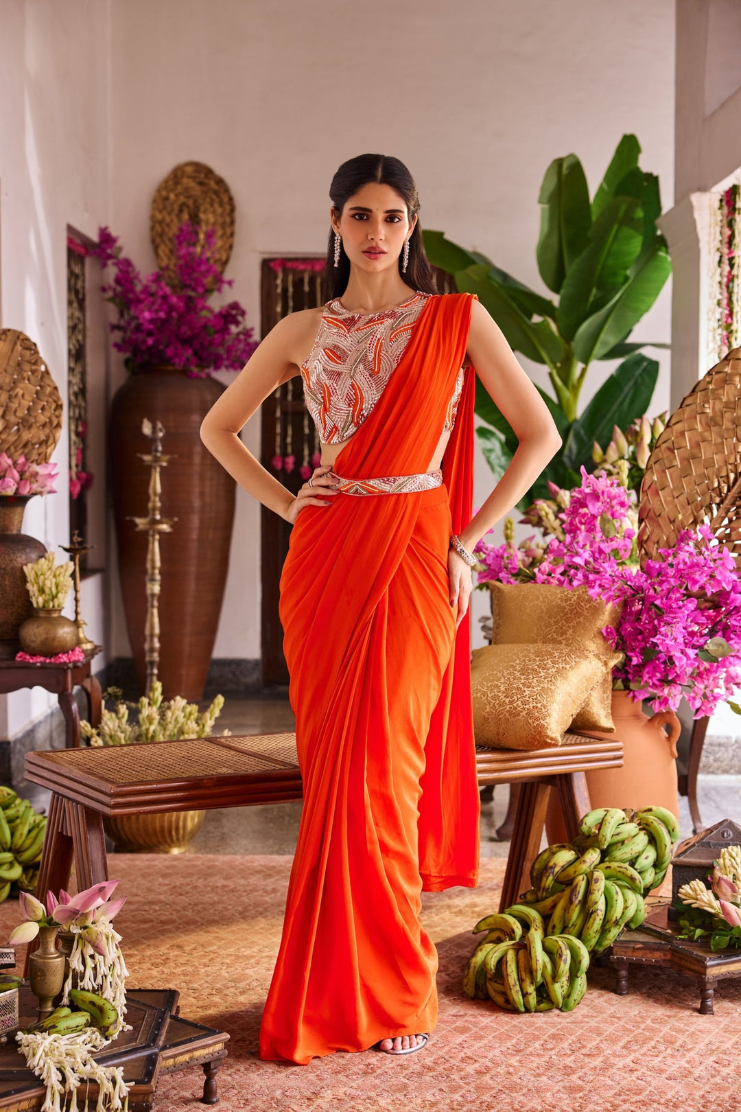 Neerus Orange crepe embroidered drape saree - front view